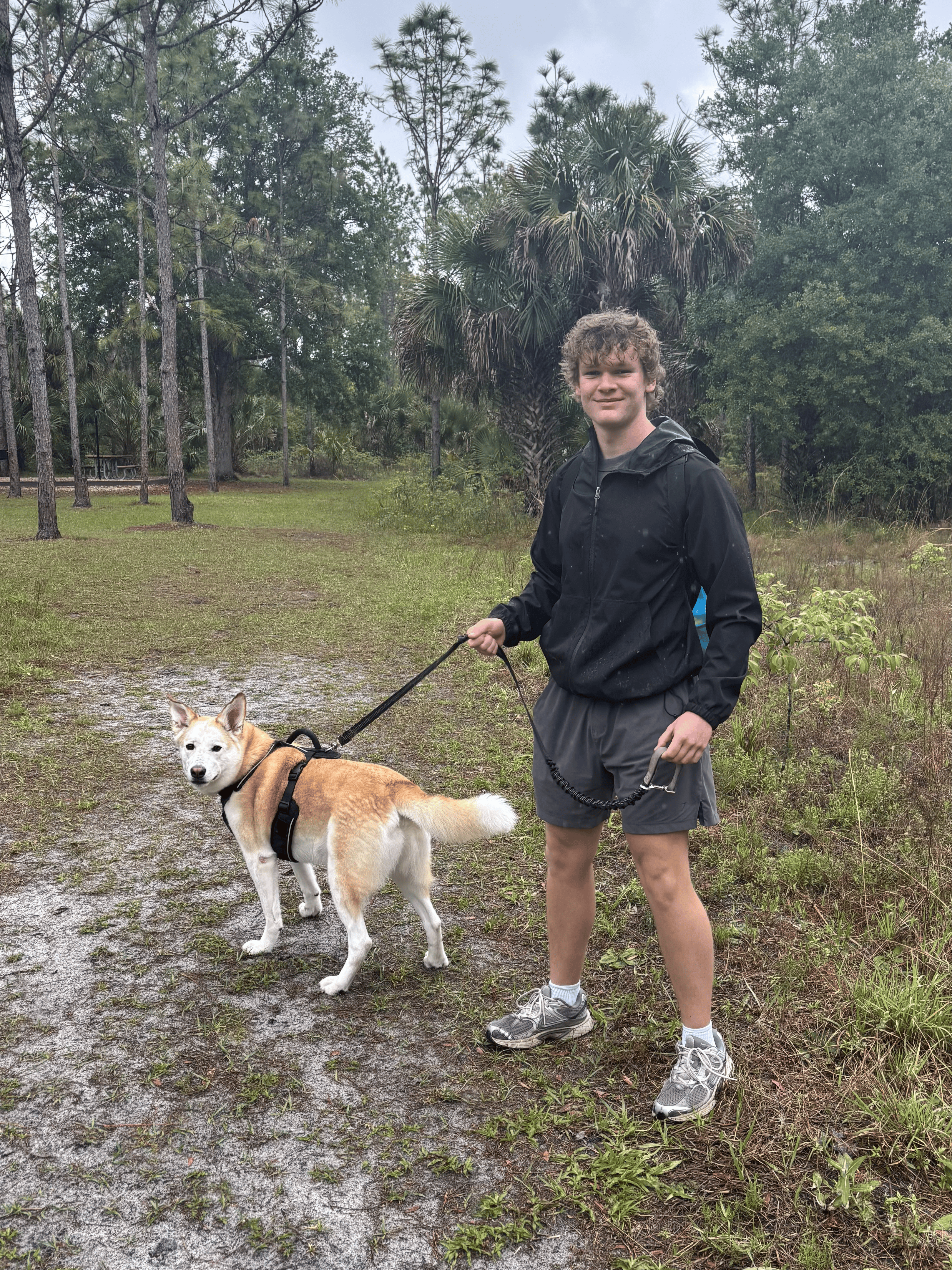 The FOMO NOMO developer spending time outdoors with a dog